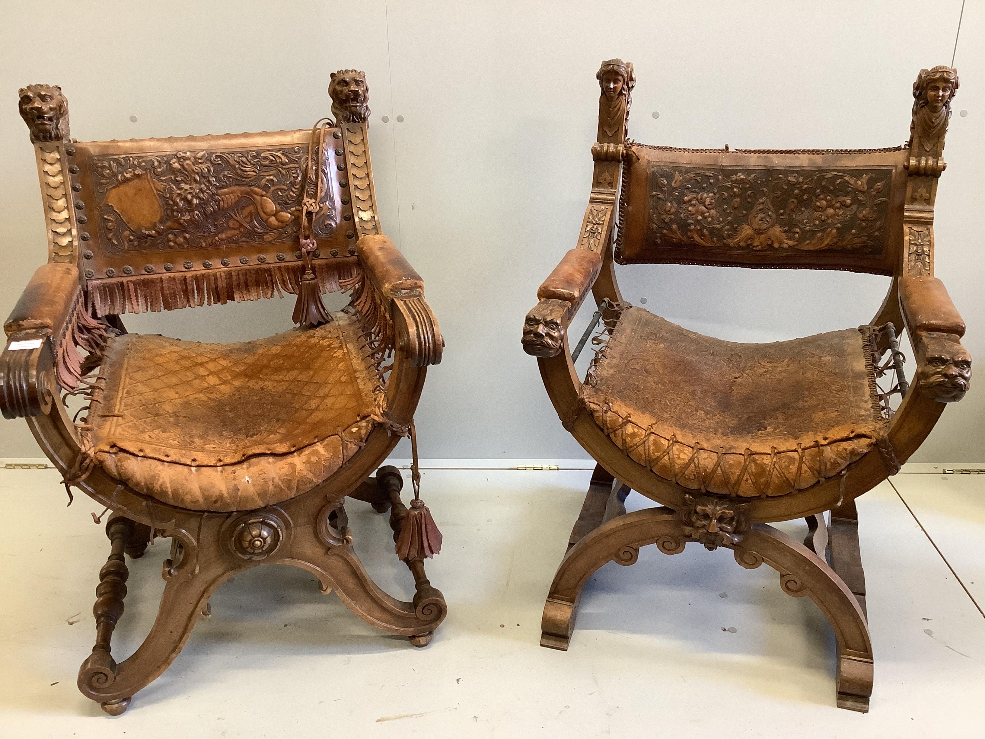 Two continental carved x-framed elbow chairs, each with tooled leather backs and carved terminals, larger width 63cm, depth 66cm, height 100cm